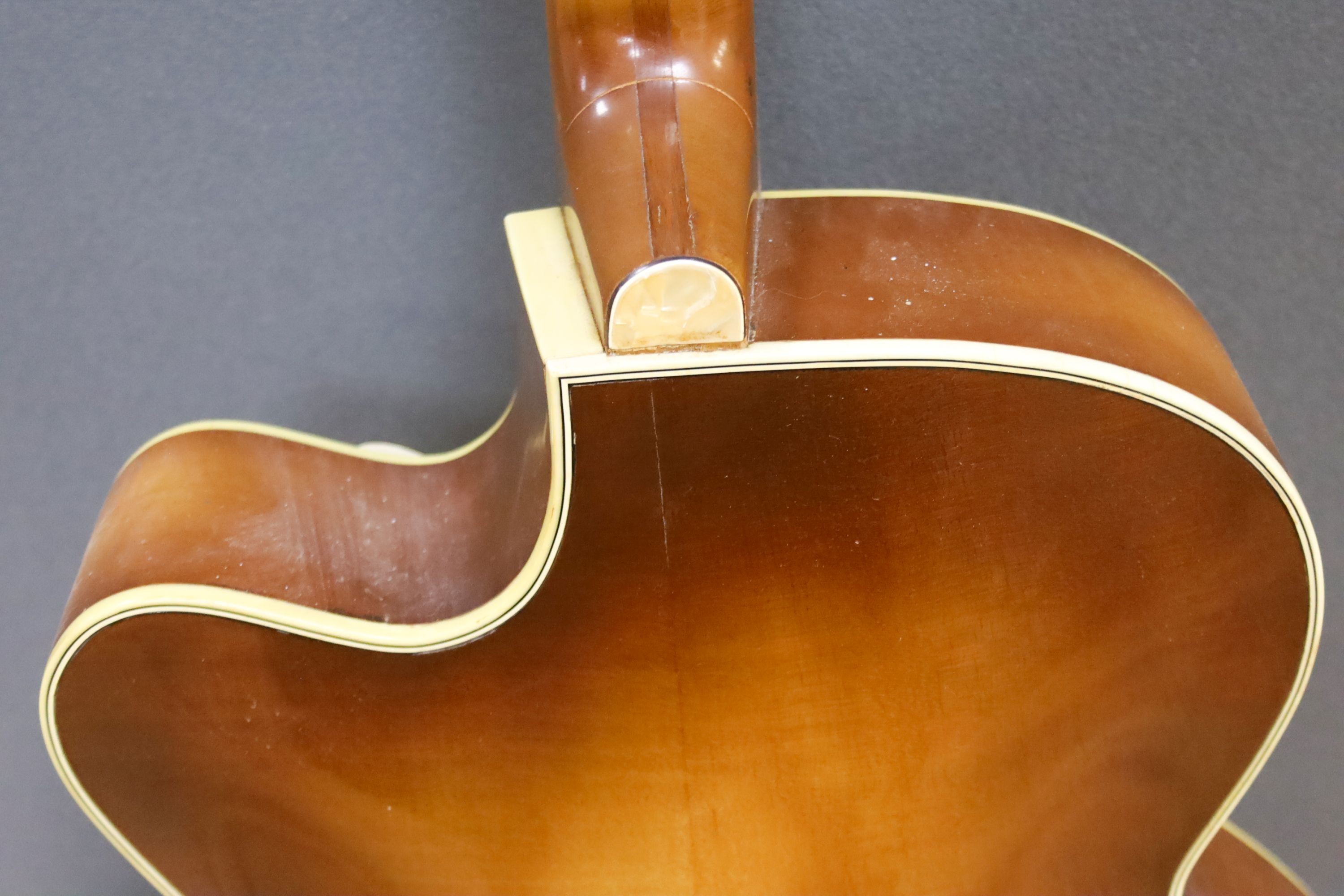 A Hofner acoustic f-hole guitar, circa 1950, having mother of pearl and tortoiseshell inlay to fret and head